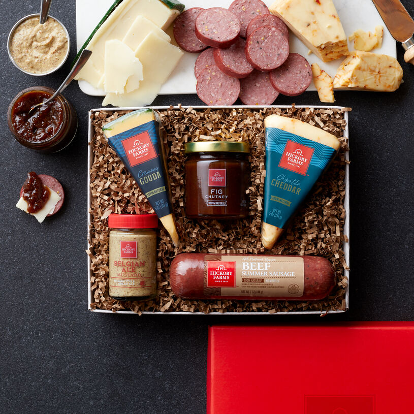 This Gift Box includes natural summer sausage, cheeses, mustard, and fig chutney